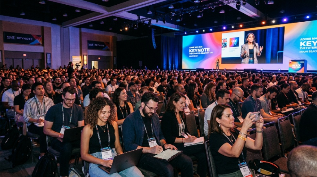 Creative professionals attending a keynote session at Adobe MAX 2026 in Miami Beach convention center